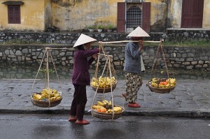 Women with baskets of fruit or other fare can be found everywhere in Vietnam. I got a try carrying one of these loads--they are heavy! 