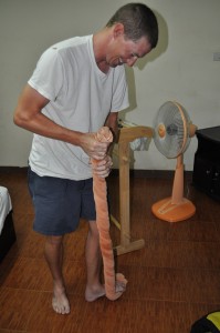 Step three: twist the towel as tight as possible, wringing out the water