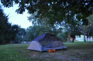 Swingset and slide in the background... town park camping at its finest!