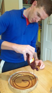 Dave, adding the very important layer of Reese's magic shell topping. Yum!