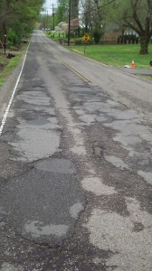 Same stretch of road, different portion. We must not be the only ones who think it's so bad, either, because when I was out taking these pictures, some guy pulled over and asked me to send them to the city councilman over this district!