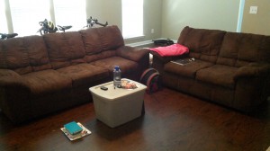 Our living room... yes, that "coffee table" is our camping storage bin. Multi-functional!